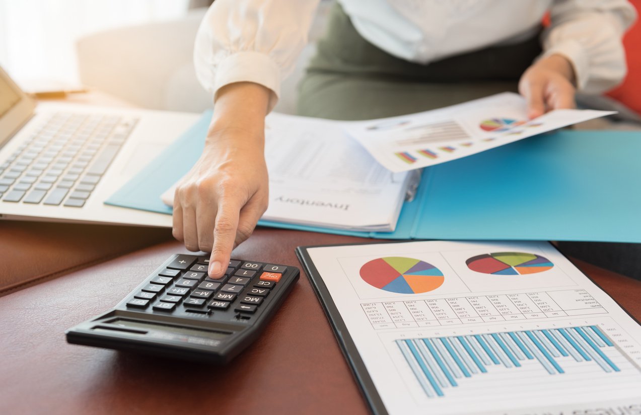 Optometry billing staff reviewing financial reports to evaluate cash flow