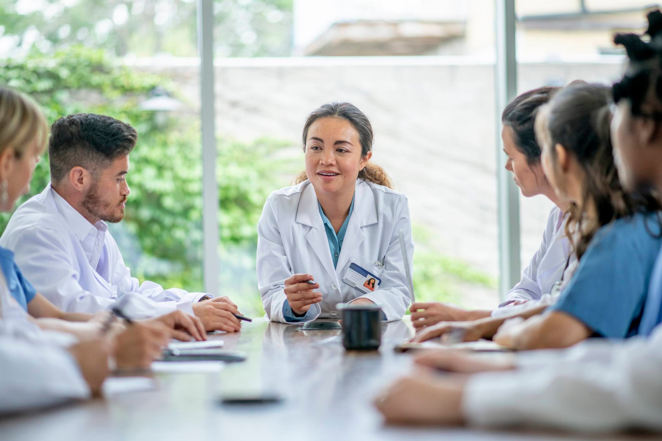 Ophthalmology team meeting discussing MIPS and compliance