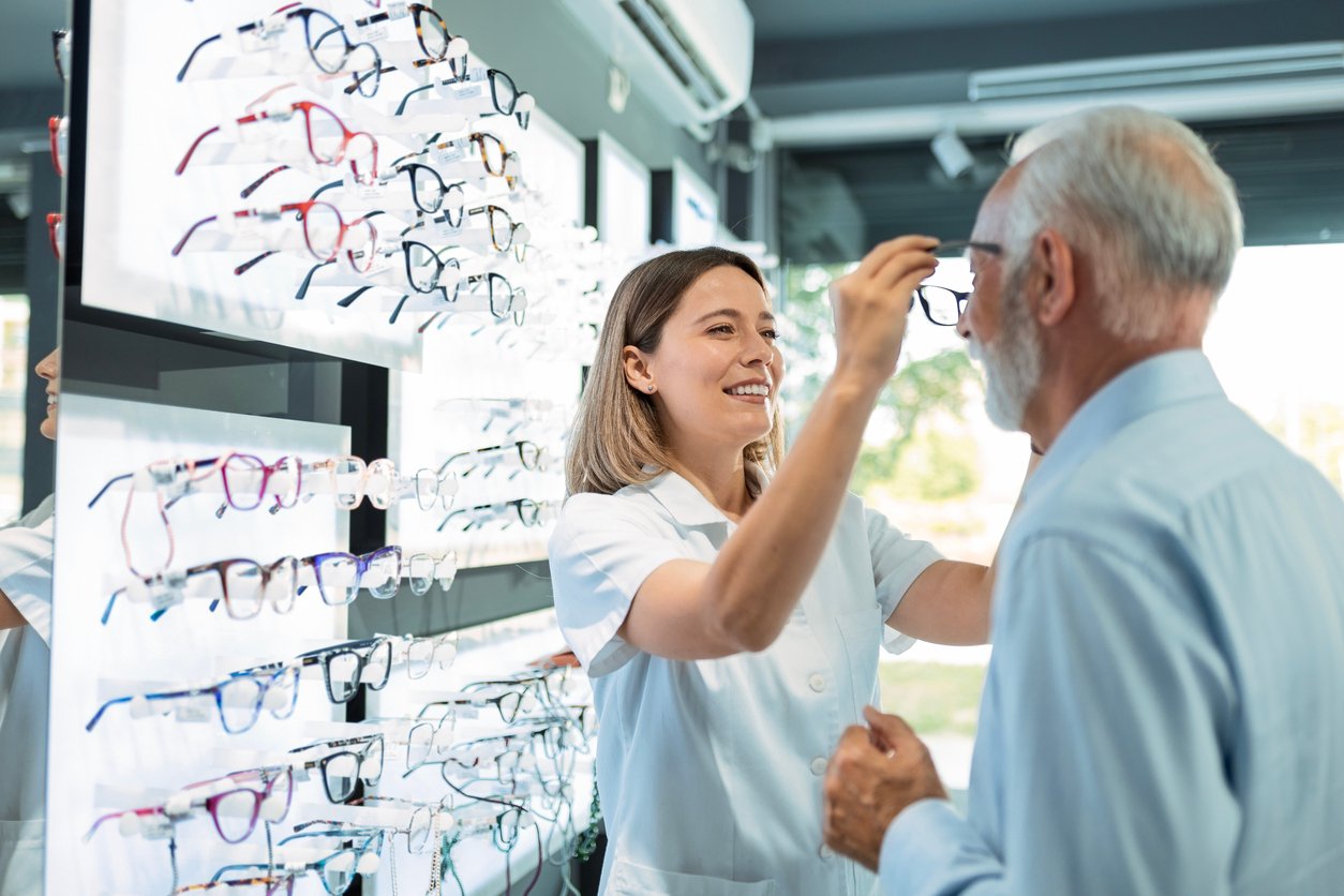 Patient trying on eyewear in an optometry practice.
