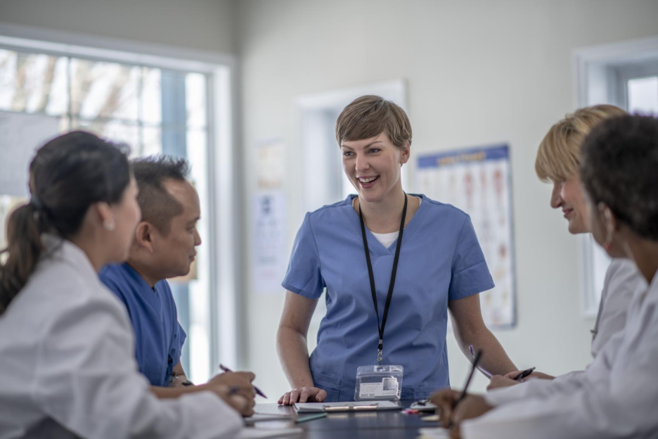 Ophthalmology care team reviewing workflows together, supporting team alignment for MIPS reporting.